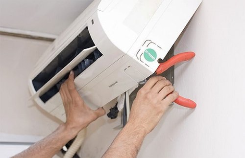 technician-using-the-cutting-blade-to-remove-the-panel