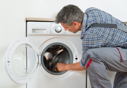 technician-checking-the-washing-machine
